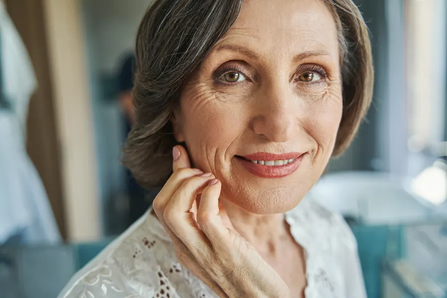 A beautiful woman smiling and posing indoors