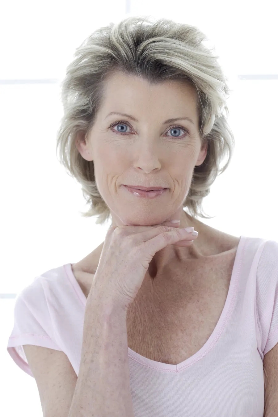 An elegant woman posing in a studio setting