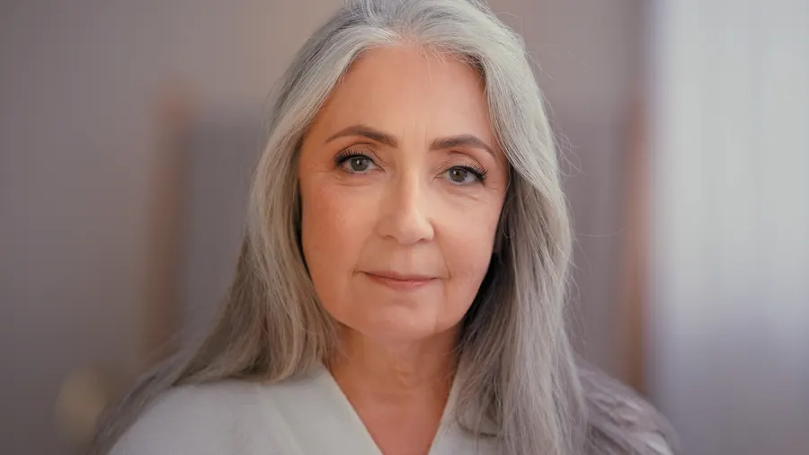 A mature woman portrait with long gray hair