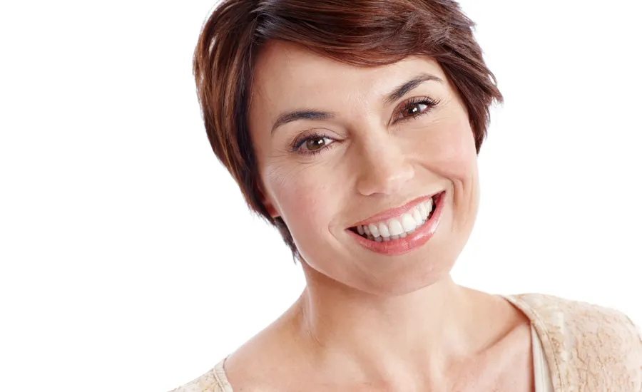 A radiant mature woman with short brown hair