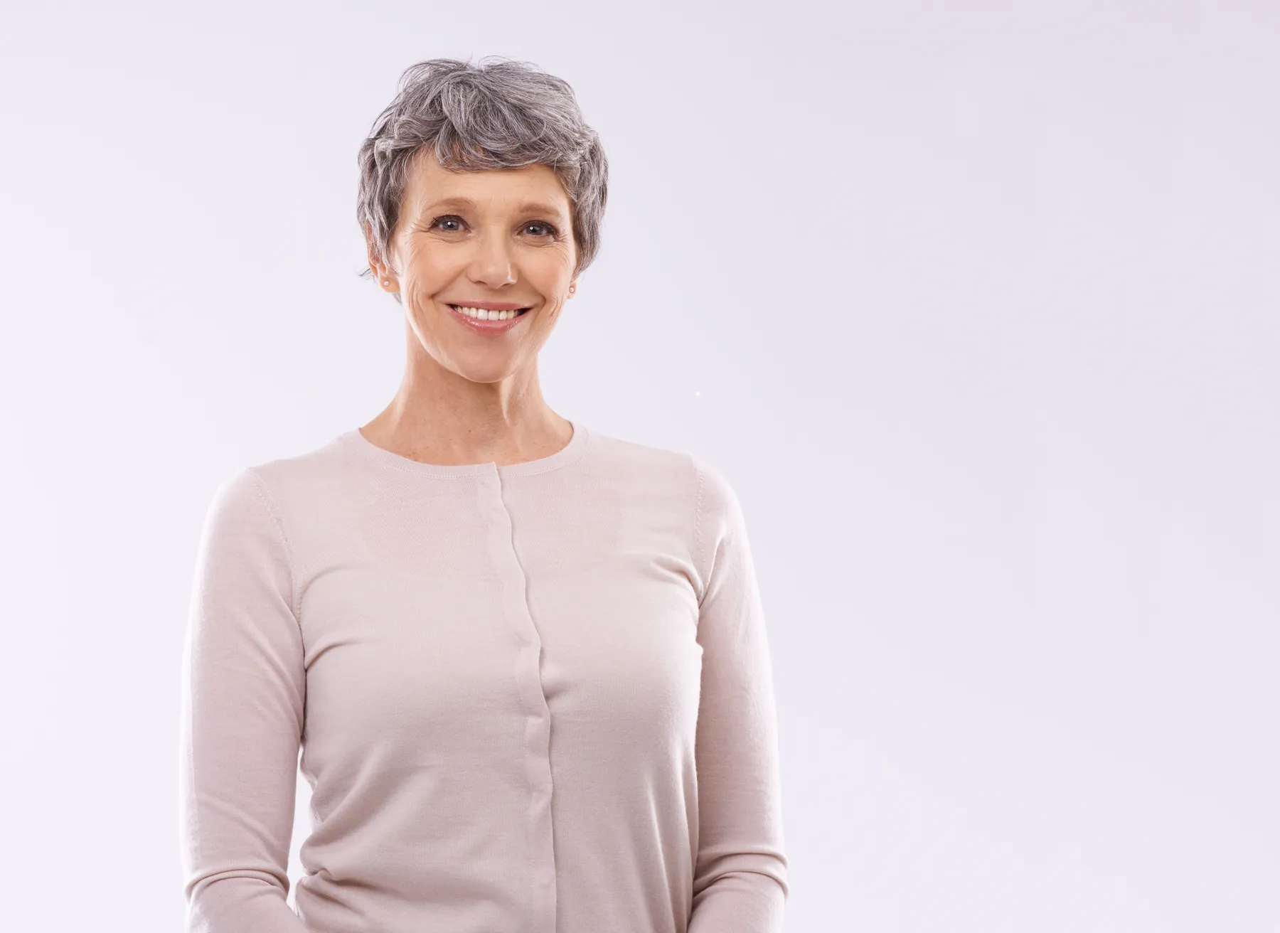 A smiling senior woman portrait on white background
