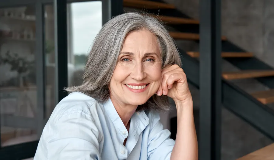 A smiling senior woman relaxing at home