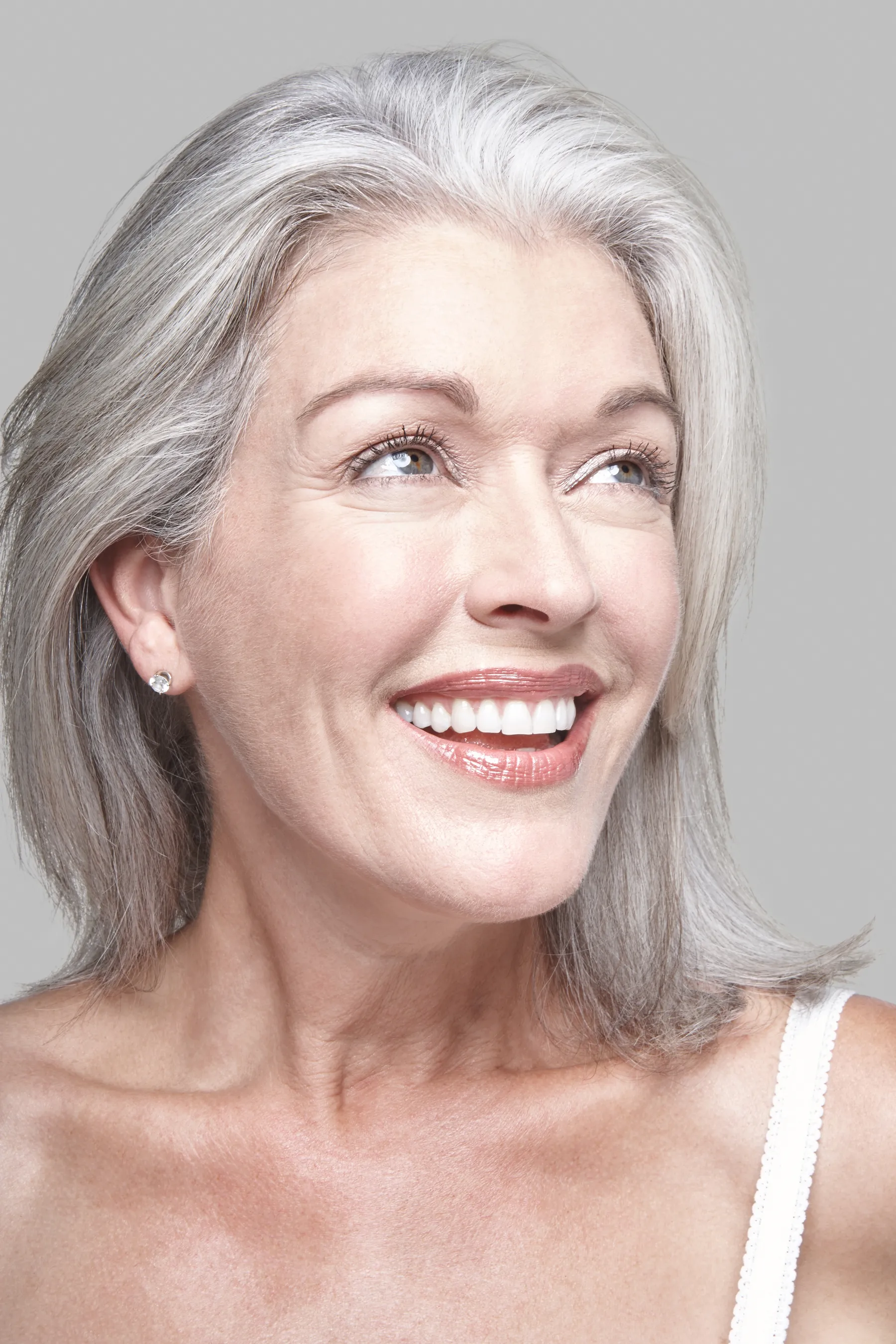 A smiling senior woman with gray hair portrait