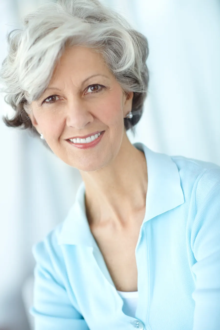 A smiling senior woman with short grey hair