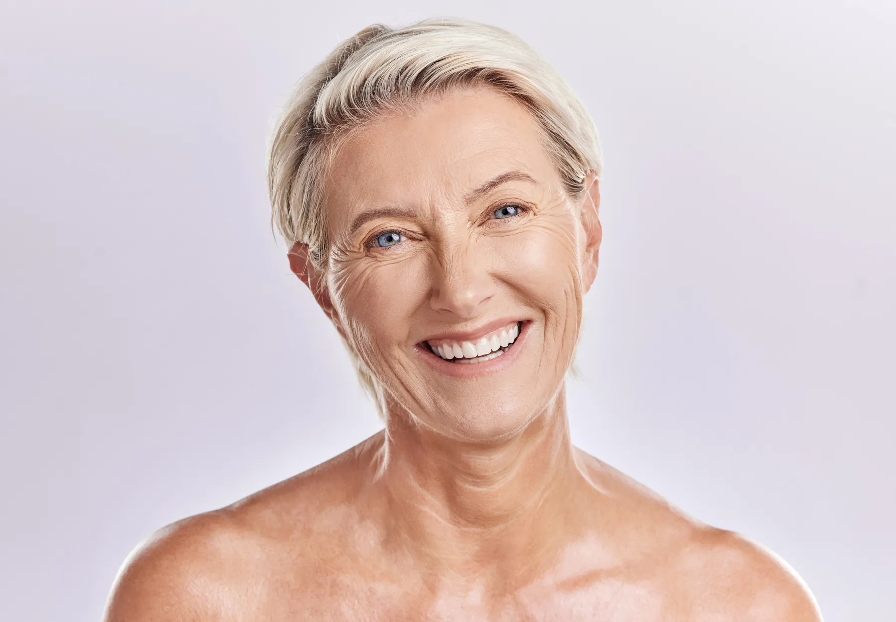 A smiling senior woman with short hair portrait