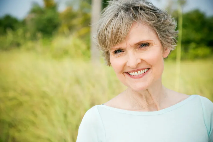 A smiling woman enjoying the outdoors