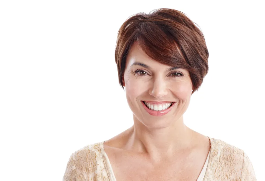 A smiling woman with short brown hair posing